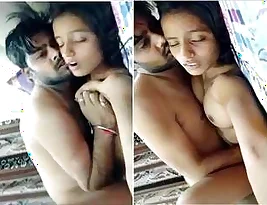 A beautiful Indian woman naked, her breasts revealed, being forcefully kissed and caressed by her husband.
