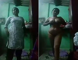 Steamy video of horny housewife stripping and exposing her large breasts and vagina