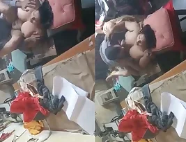 A chubby middle-aged woman has sex with a worker in a factory.