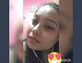 A pretty young woman is displaying her breasts and vagina.