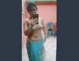 A sexy woman stripping off her saree for her loved one.