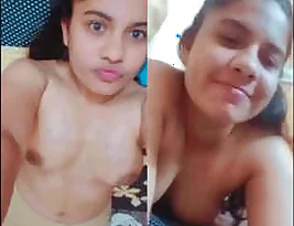 A sexy college student exposing her breasts and private parts.
