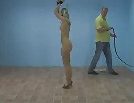 Skinny blonde gets her ass spanked and teased with a bare eyelash.