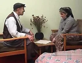 A Turkish man has sex with his wife while wearing a turban in this homemade porn video.