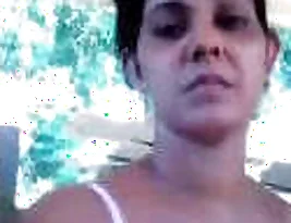 A married woman is exposing her breasts and shaved vulva.