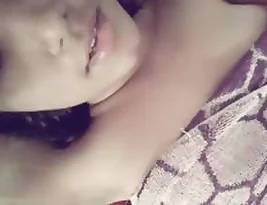 Pretty Indian teenage girl exposing and rubbing her genitals.