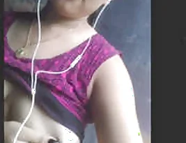 A beautiful girl enjoys playing with her boobs.