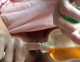 Amateur girl masturbates with mustard oil in part 2
