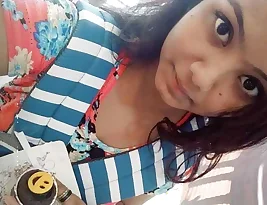 An sexy college girl exposing her breasts to her loved one.