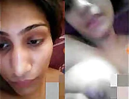 An nude Indian woman stripping