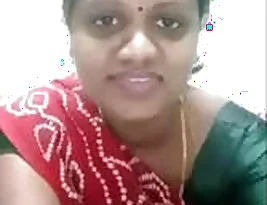 A Tamil woman undressing herself.