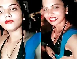 An Indian aunt flaunts some cleavage while dancing.