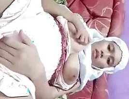 A pretty hijab wearing girl from Indo shows her big pussy
