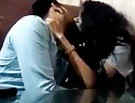 A steamy kissing scene in a cafe with an Indian couple