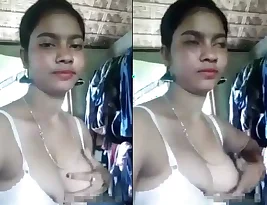 Indian girl showing her breasts in a bra.