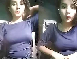 There is a very beautiful Indian girl and you can see her in a tight dress as she flaunts her charms to a loved one.