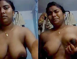 A young girl from Tamil Nadu playing with her big boobs.