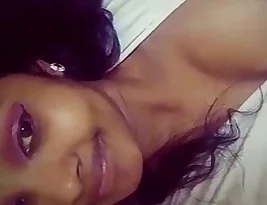 A student from a college in India exposes her breasts to her lover.