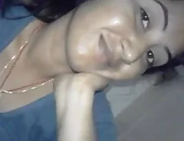 A woman from South Asia exposes her breasts and genitals to her loved one.