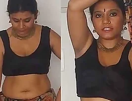 Hot Bengali beauty shares her succulent navel in a Sara blouse.
