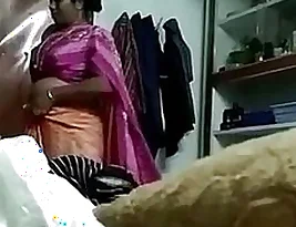 A spy camera captures a Desi aunty wearing a saree.