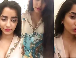 A beautiful girl from South Asia performing a solo sex act and communicating with the audience.