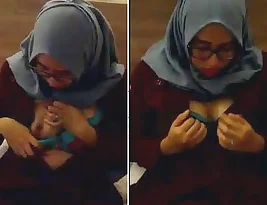 A girl who wears a hijab exposes her big breasts for her boyfriend and gives him a blow job.