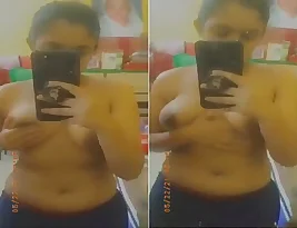Pretty Indian woman takes self-portraits with her breasts.