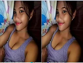 A young Indian woman exposes her breasts during a video call.