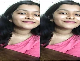 Beautiful Indian young woman undresses in this exclusive set.