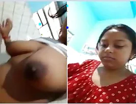 Small-breasted Indian woman displays her big assets and urinates.