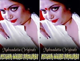 Megha wears a white Pakistani suit in a video.