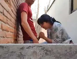 An Indian woman enjoys giving oral sex and having intercourse in open places.