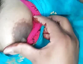 A very horny girl squeezes and play with her breasts.