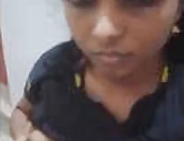 A girl from Andhra shows her small bosom on camera.
