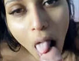 Hot Indian woman enjoying a blowjob with an ice cream cone with a stick.