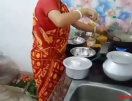 Hot housewife in red saree has hardcore sex with farm worker in this homemade video.
