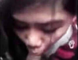 Hot woman from the East gives a blow job in a car